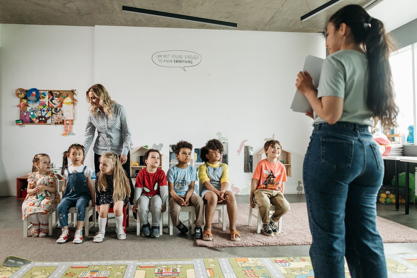 Children sitting together for circle time with their teacher
